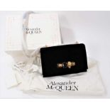 Designer Alexander McQueen Knuckle Duster Handbag in quilted black velvet, skulls and gilt chain. I