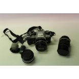 Nikon FA 35mm SLR camera with three Nikon Series E lenses: 28mm f/2.8, 50mm f/1.8 and 135mm f/2.8