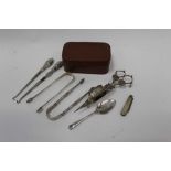Group of silver to include two pairs of Georgian sugar tongs, silver fruit knife, silver button hook