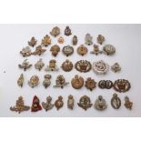 Collection of approximately 38 British Military cap badges to include Royal Engineers, Royal Artille