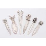 Six silver novelty bookmarks each mounted with a bear, owl, fairy, sunshine, dove and horse with hor