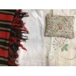 A quantity of table linens including crochet edge table cloths, embroidered cloths, pulled thread wo