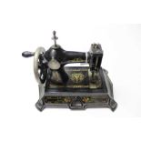 Vintage German painted cast iron miniature sewing machine