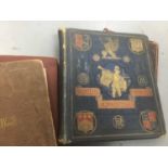 Four 19th century albums of crests, armorials and ephemera