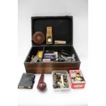 Wooden box containing games, silver spoons, whistles, pipes and sundries,