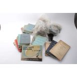 Collection of Second World War and later Infantry training manuals together with two gas masks (1 bo