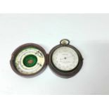 Late 19th / early 20th century pocket barometer by Lawrence & Mayo, London, 5cm diameter, in leather