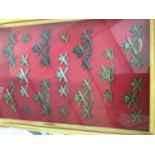 Collection of British and Commonwealth Machine Gun Regimental badges mounted in glazed frame (37 bad