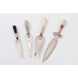 White metal sword bookmark with banded agate handle and three silver trowel bookmarks (4)