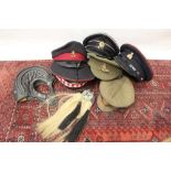 Group of seven various Military hats to include a leather Soviet tank crew helmet, a 1920's Royal Ar