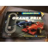 Scalextric Grand Prix box set, plus additional track and Hornby tank engine, tender, rolling stock a