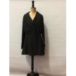 Victorian black long jacket with three long black skirts.