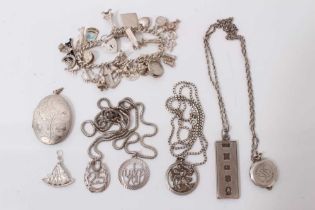 Group silver jewellery including a charm bracelet and various pendants on chains