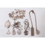 Group silver jewellery including a charm bracelet and various pendants on chains