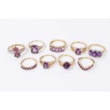 Nine 9ct gold purple gem stone dress rings