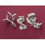 Four Buckingham pewter limited edition animal ornaments including elephants, lions etc and three pew