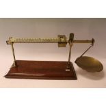 Rare Avery precision balance scales on mahogany base, with scales reading 'Oz', 'Oz per dozen', and