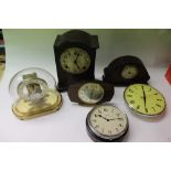 Collection of vintage clocks, including wall clocks, travel clocks and mantel clocks