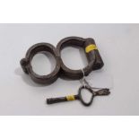 Pair of Edwardian steel figure of eight hand cuffs stamped Hiatt, Birmingham M&C 1901, together with