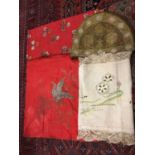A box of linen and lace including Chinese embroidered square, red cotton panel with hand embroidere