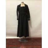 Circa 1910 Black dress with flat central panel in bodice and collar, both with lace decoration. Wide