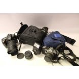 Pentax camera and a Nikon D90 camera