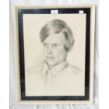 A framed 1974 pencil portrait of a young man
