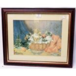 A framed coloured print, depicting kittens in a basket