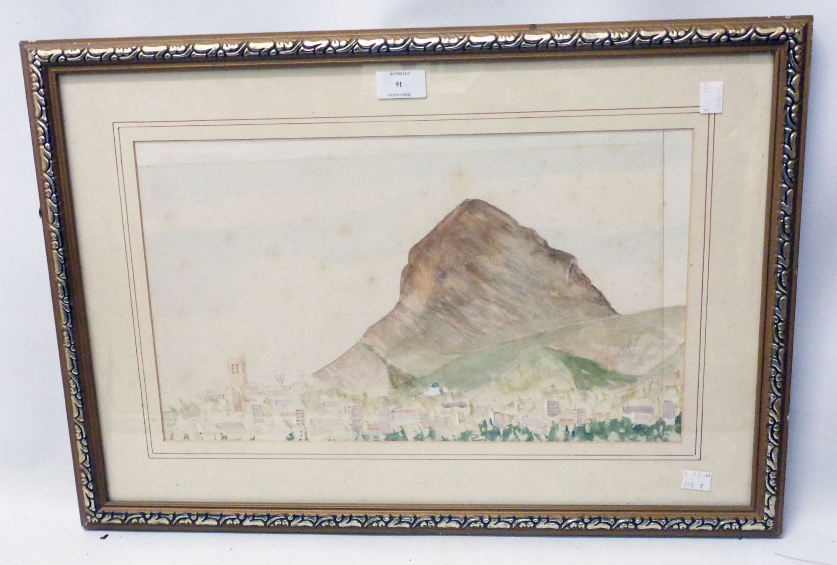 A gilt framed faded watercolour (slipped in frame) view of Montgo, Spain