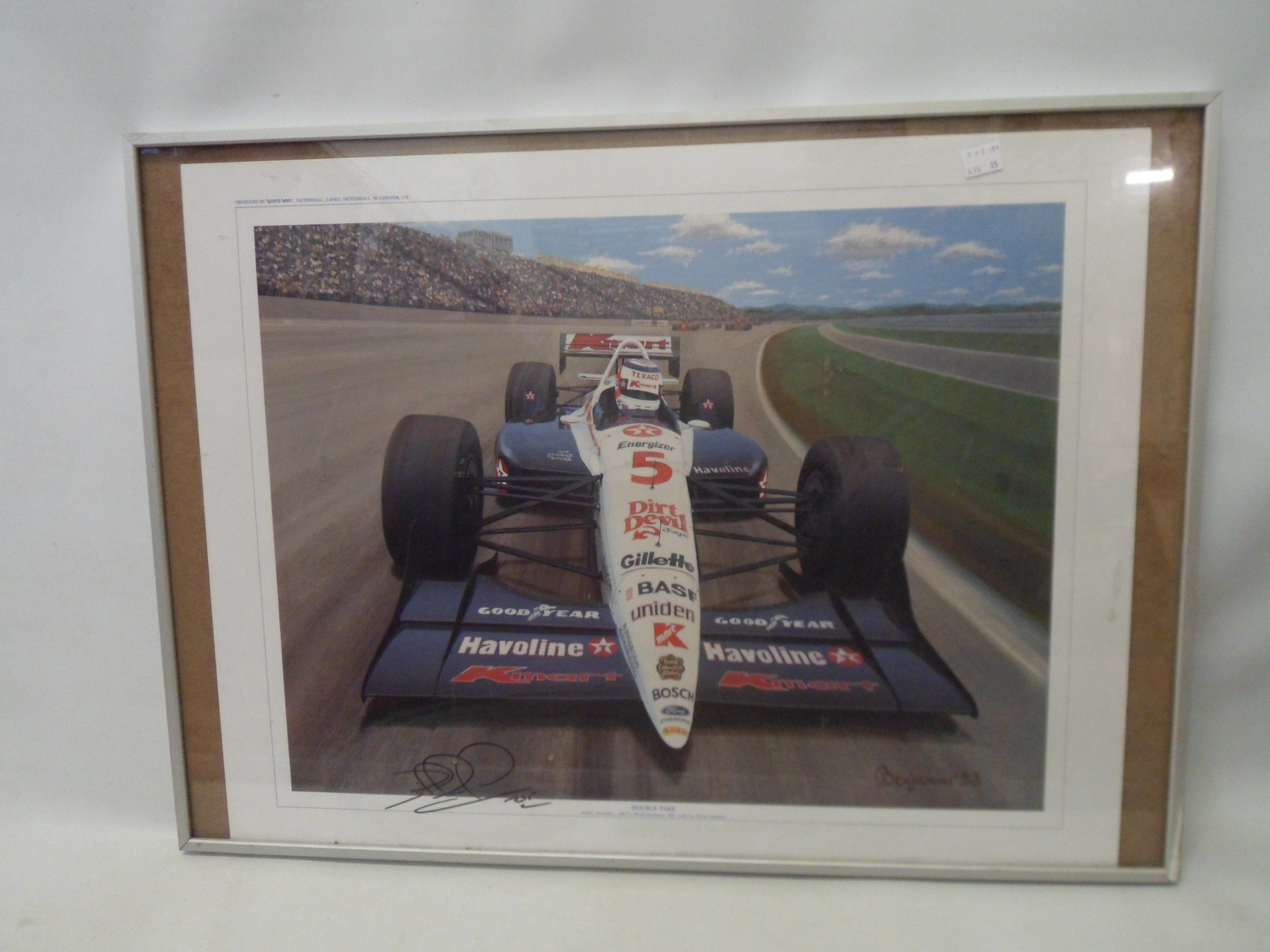 A framed Sports Seen coloured print signed by Nigel Mansell and entitled Double Take