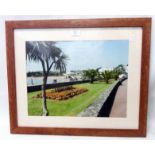 A framed photograph, depicting the esplanade in Torquay