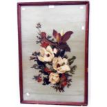 A framed oil painting on glass still life spray of flowers