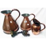 Two old copper measures, a jug and two bells