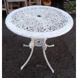 A 69cm diameter painted aluminium garden table with decorative pierced top