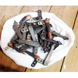 A bag of assorted brass and coppered brass stair clips - various patterns