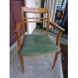 A pair of 20th Century Meredew Avalon stained wood framed elbow chairs with green velour upholstered