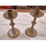 A pair of Victorian brass candlesticks in the Gothic style