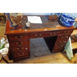 A 1.22m late Victorian mahogany twin pedestal desk with remains of rexine inset top, three frieze