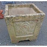 A square form concrete garden planter, decorated with moulded "Tudor Rose" panels