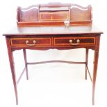 An 84cm Edwardian mahogany and strung writing table with lift top compartment to superstructure,