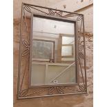 A modern painted metal framed decorative oblong wall mirror