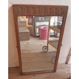 An oak framed oblong mirror from a dressing table