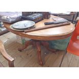 A 1.34m Victorian mahogany oval tilt-top loo table, set on massive turned pillar and cabriole scroll