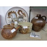 Six pieces of studio pottery including Greyshott horse pattern plate, Winchcombe flagon, cut sided