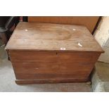 A 78cm Victorian waxed pine lift-top box with internal compartment and flanking iron handles