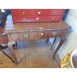 A 80cm 20th Century walnut side table with shaped top and two frieze drawers, set on cabriole legs