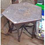 A 76cm late Victorian carved oak hexagonal topped occasional table, set on turned supports and