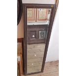 A 39.5cm wide 20th Century stained wood framed narrow bevelled oblong wall mirror