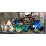 Thirteen Torquay pottery tulip or udder vases including Aller Vale, Longpark, HM Exeter, etc.