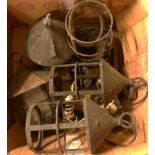 A box of assorted wrought iron and other lamps and sconces